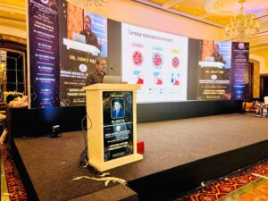 dr-rohit-pai-cancer-doctor-specialist-on-stage-giving-talk-about-cancer-awareness